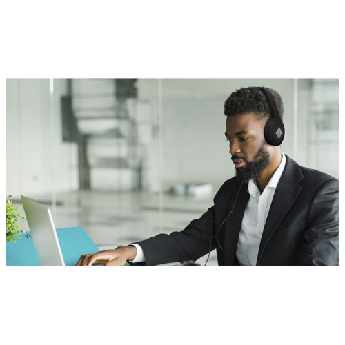 African american man customer support operator with hands-free headset working in the office.